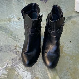 Black leather heeled booties with side buckle